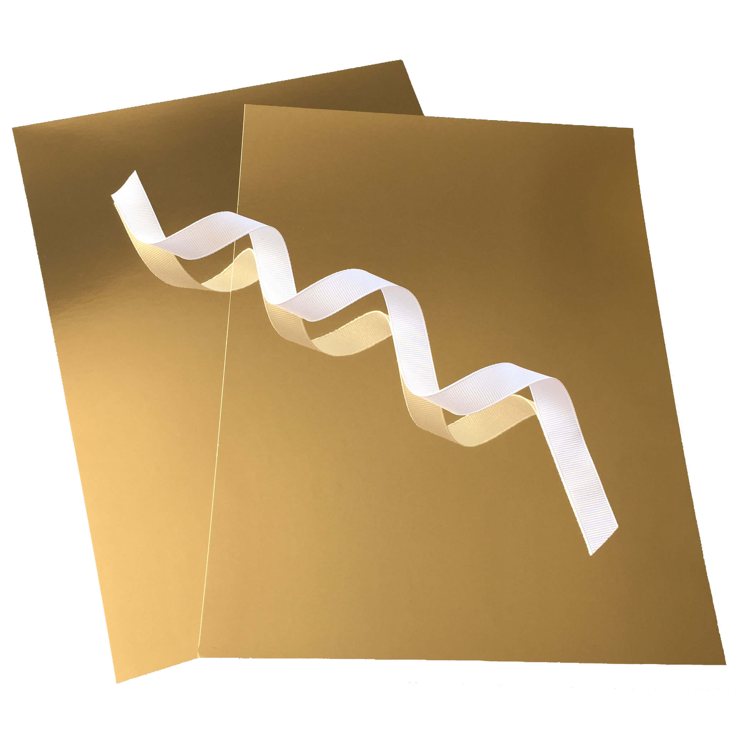 A white ribbon reflected in gold mirror cardstock