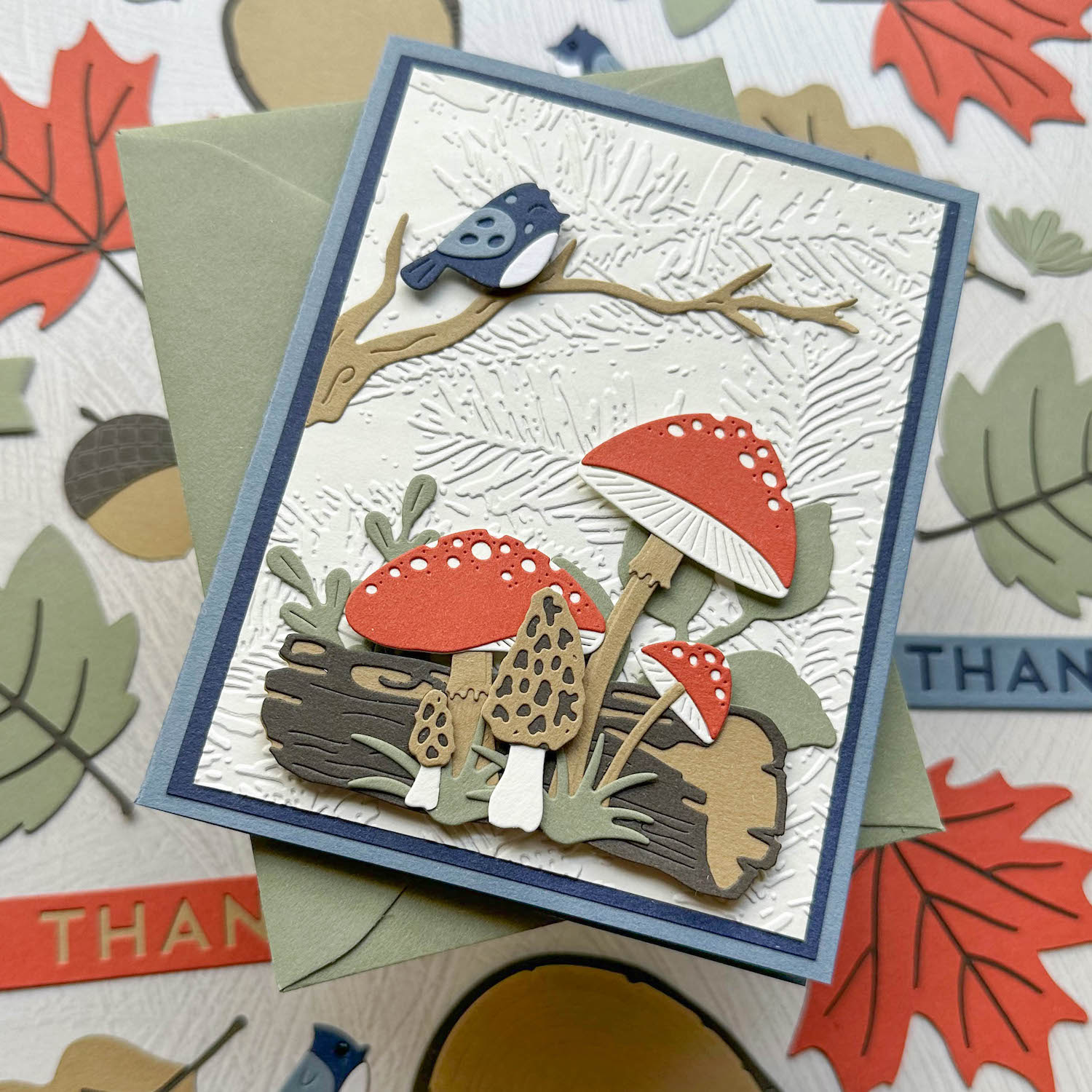 Layered mushroom and bird card with earthy Materica paper shapes